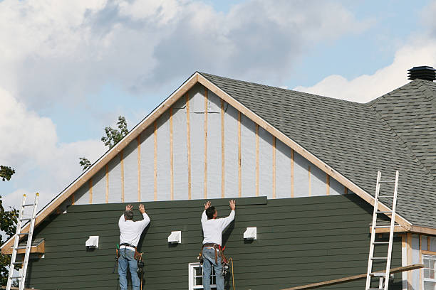 Professional Siding Replacement technician working in Wellsville, PA